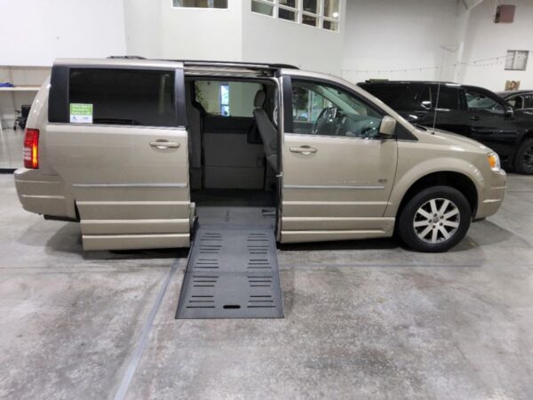 Gold Chrysler Town and Country with BraunAbility Side Entry Automatic Fold Out conversion
