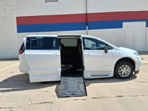 White Chrysler Pacifica with BraunAbility Side Entry Automatic Fold Out conversion