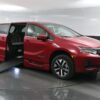 Red Honda Odyssey with BraunAbility Side Entry Automatic In Floor conversion