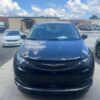 Black Chrysler Voyager with BraunAbility Side Entry Automatic Fold Out conversion