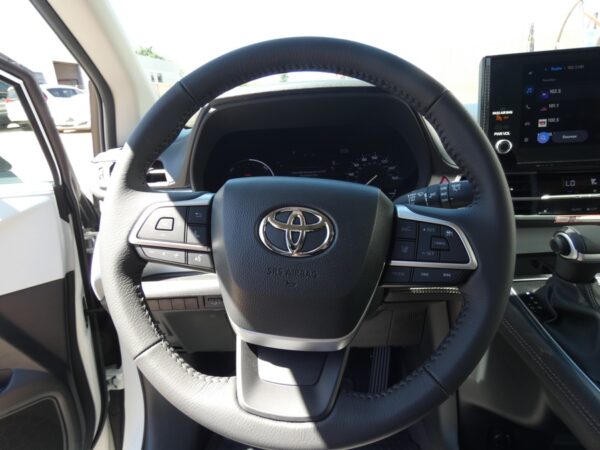 White Toyota Sienna with Driverge Rear Entry Manual Fold Out conversion
