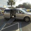 Silver Dodge Grand Caravan with Driverge Side Entry Automatic Fold Out conversion