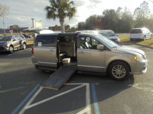 Silver Dodge Grand Caravan with Driverge Side Entry Automatic Fold Out conversion