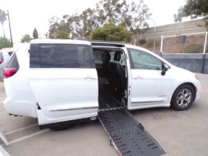 White Chrysler Pacifica with Driverge Side Entry Automatic Fold Out conversion