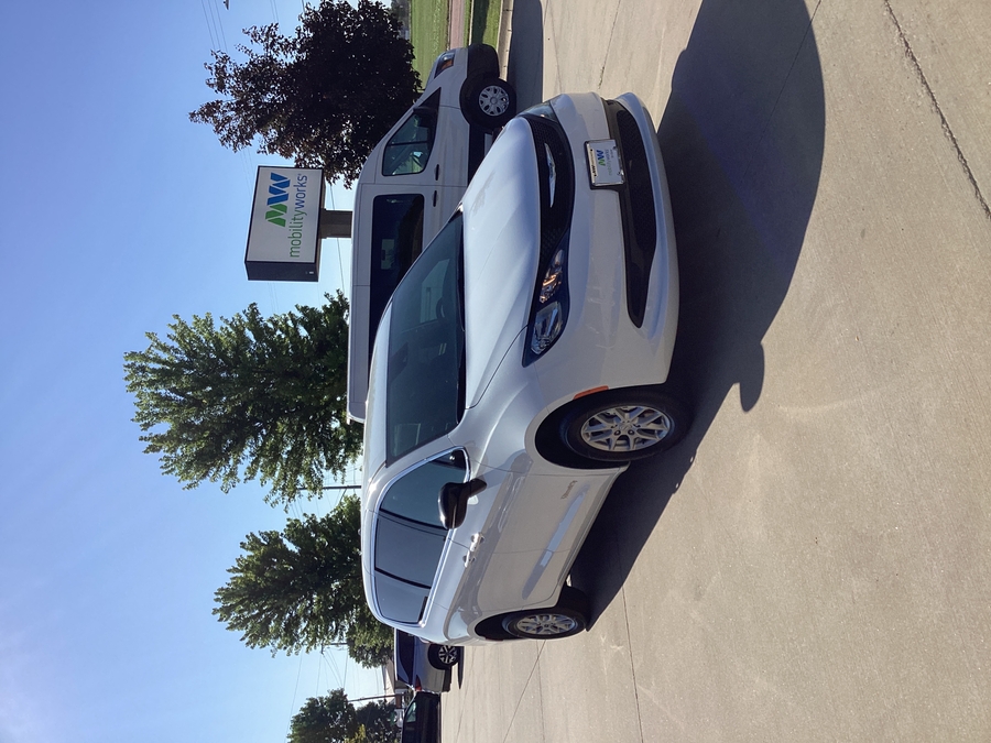 White Chrysler Voyager with BraunAbility Rear Entry Manual Fold Out conversion