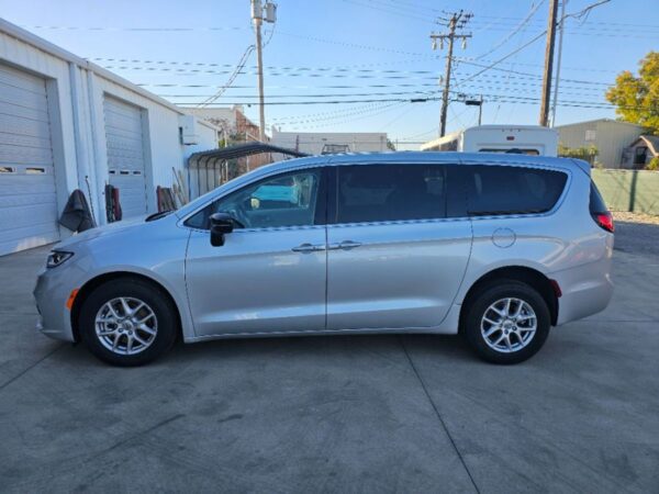 Silver Chrysler Pacifica with Driverge Rear Entry Manual Fold Out conversion