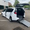 White Chrysler Pacifica with Driverge Rear Entry Manual Fold Out conversion