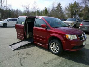 Red Dodge Grand Caravan with BraunAbility Side Entry Automatic Fold Out conversion