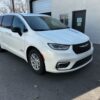 White Chrysler Pacifica with Driverge Rear Entry Manual Fold Out conversion