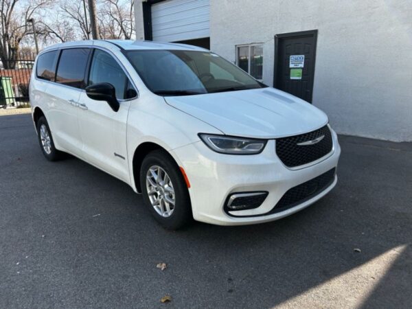 White Chrysler Pacifica with Driverge Rear Entry Manual Fold Out conversion