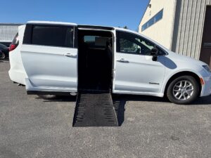 White Chrysler Voyager with Driverge Side Entry Automatic Fold Out conversion