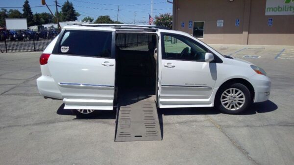 White Toyota Sienna with BraunAbility Side Entry Automatic Fold Out conversion