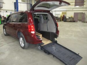 Red Dodge Grand Caravan with BraunAbility Rear Entry Manual Fold Out conversion