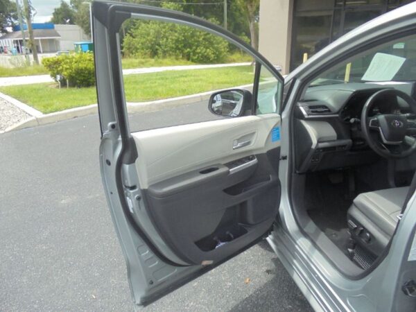 Silver Toyota Sienna with Driverge Rear Entry Manual Fold Out conversion