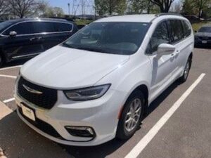White Chrysler Pacifica with Driverge Rear Entry Manual Fold Out conversion