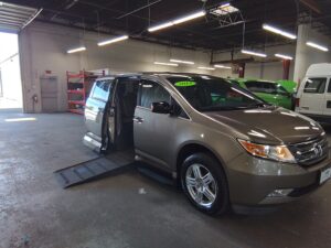 Tan Honda Odyssey with Vantage Mobility Side Entry Automatic In Floor conversion