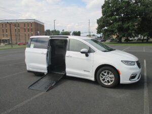 White Chrysler Pacifica with Driverge Side Entry Automatic Fold Out conversion
