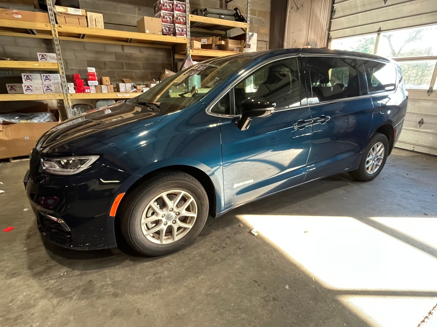 Blue Chrysler Pacifica with Driverge Side Entry Automatic Fold Out conversion
