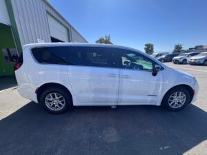 White Chrysler Voyager with Driverge Side Entry Automatic Fold Out conversion