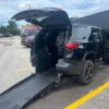 Black Chevrolet Traverse with Freedom Motors Rear Entry Manual Fold Out conversion