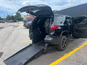 Black Chevrolet Traverse with Freedom Motors Rear Entry Manual Fold Out conversion