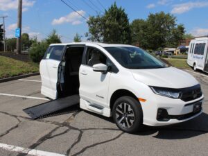 White Honda Odyssey with BraunAbility Side Entry Automatic In Floor conversion