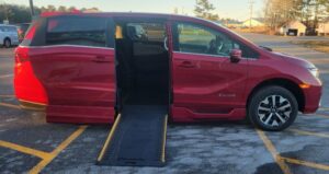 Red Honda Odyssey with BraunAbility Side Entry Automatic In Floor conversion