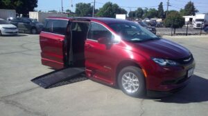 Red Chrysler Voyager with BraunAbility Side Entry Automatic Fold Out conversion