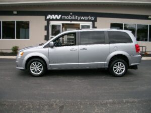 Silver Dodge Grand Caravan with BraunAbility Rear Entry Manual Fold Out conversion