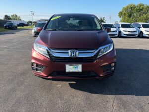 Red Honda Odyssey with BraunAbility Side Entry Automatic In Floor conversion