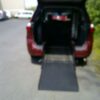 Red Toyota Sienna with BraunAbility Rear Entry Automatic Fold Out conversion