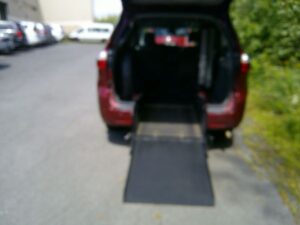Red Toyota Sienna with BraunAbility Rear Entry Automatic Fold Out conversion