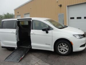 White Chrysler Voyager with Driverge Side Entry Automatic Fold Out conversion