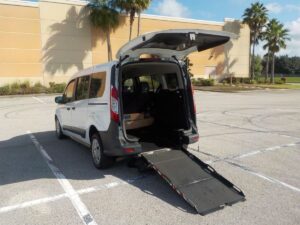 White Ford Transit Connect with Driverge Rear Entry Manual Fold Out conversion