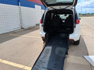 White Chrysler Voyager with BraunAbility Rear Entry Manual Fold Out conversion
