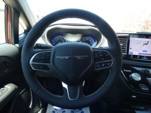 Red Chrysler Pacifica with BraunAbility Side Entry Automatic In Floor conversion