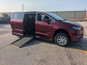 Red Chrysler Pacifica with Driverge Side Entry Automatic Fold Out conversion