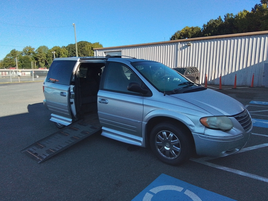 Silver Chrysler Town and Country with BraunAbility Side Entry Automatic Fold Out conversion