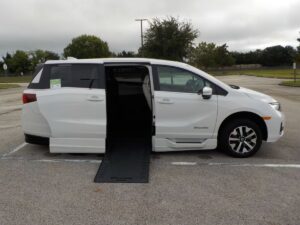 White Honda Odyssey with BraunAbility Side Entry Automatic In Floor conversion