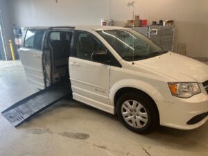 White Dodge Grand Caravan with BraunAbility Side Entry Automatic Fold Out conversion
