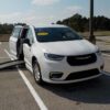 White Chrysler Pacifica with BraunAbility Side Entry Automatic Fold Out conversion
