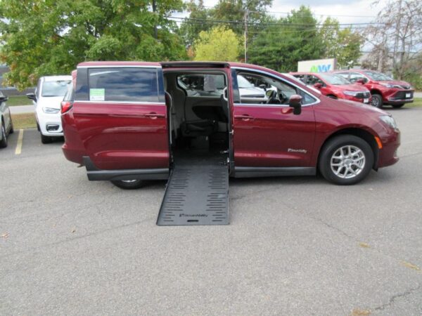 Red Chrysler Voyager with BraunAbility Side Entry Manual Fold Out conversion