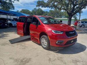 Red Chrysler Pacifica with BraunAbility Side Entry Automatic In Floor conversion