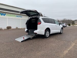 White Chrysler Pacifica with Driverge Rear Entry Manual Fold Out conversion