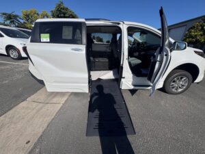 White Toyota Sienna with BraunAbility Side Entry Automatic Fold Out conversion