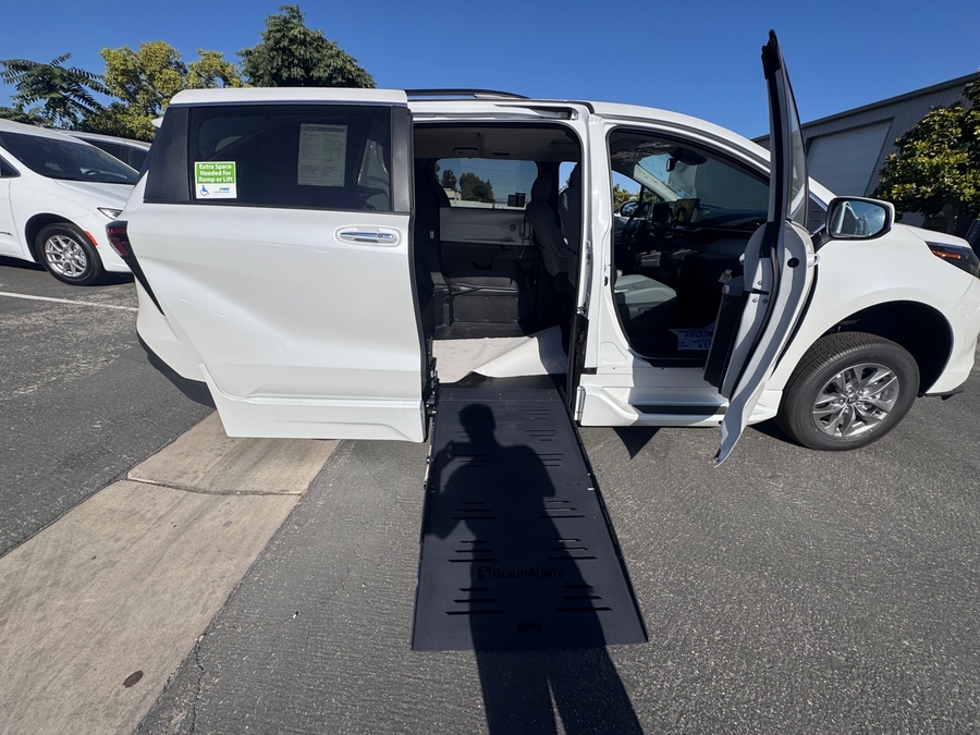 White Toyota Sienna with BraunAbility Side Entry Automatic Fold Out conversion