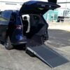 Blue Toyota Sienna with Driverge Rear Entry Manual Fold Out conversion