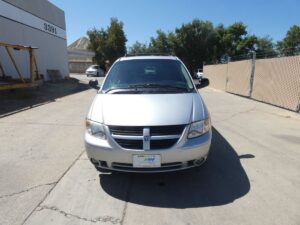 Silver Dodge Grand Caravan with BraunAbility Side Entry Automatic Fold Out conversion
