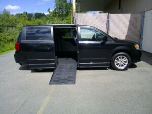 Black Dodge Grand Caravan with BraunAbility Side Entry Automatic Fold Out conversion