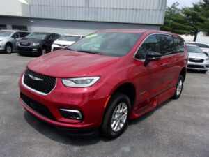 Red Chrysler Pacifica with BraunAbility Side Entry Automatic Fold Out conversion